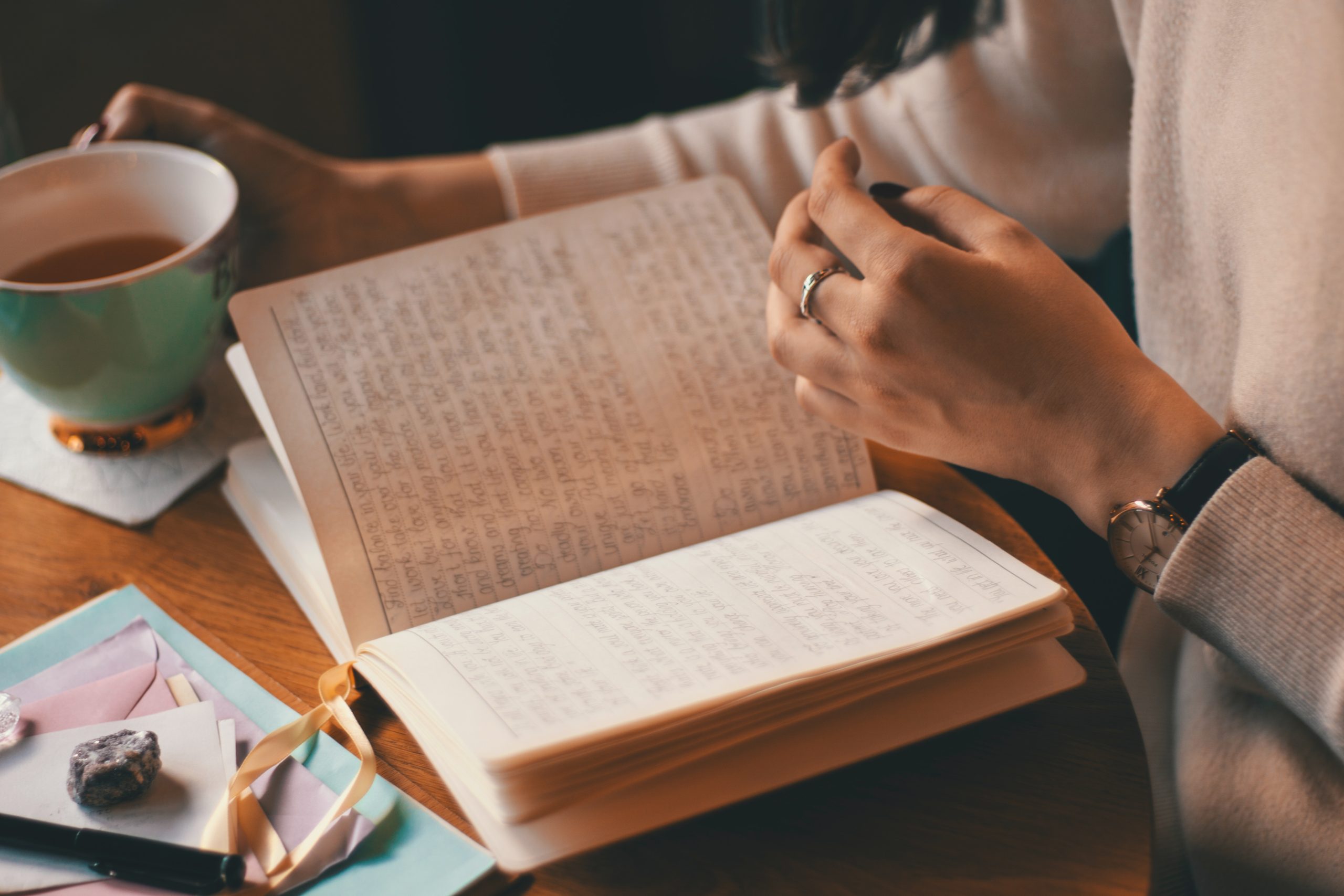 reading book while having coffee